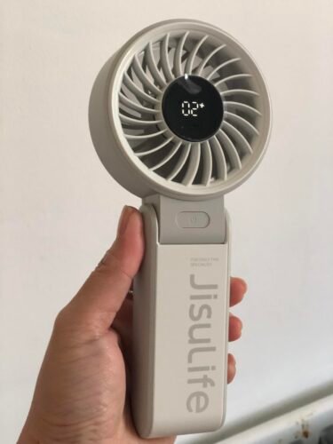 JISULIFE Handheld Fan Life7 – Ultimate Flexibility: High-Power Motor. LED Display. 19.5 Hrs Cooling. 5000mAh Rechargeable. 5-Speed. Foldable Design. 3-IN-1 Portable Fan for Travel Cruise Beach(Grey) photo review