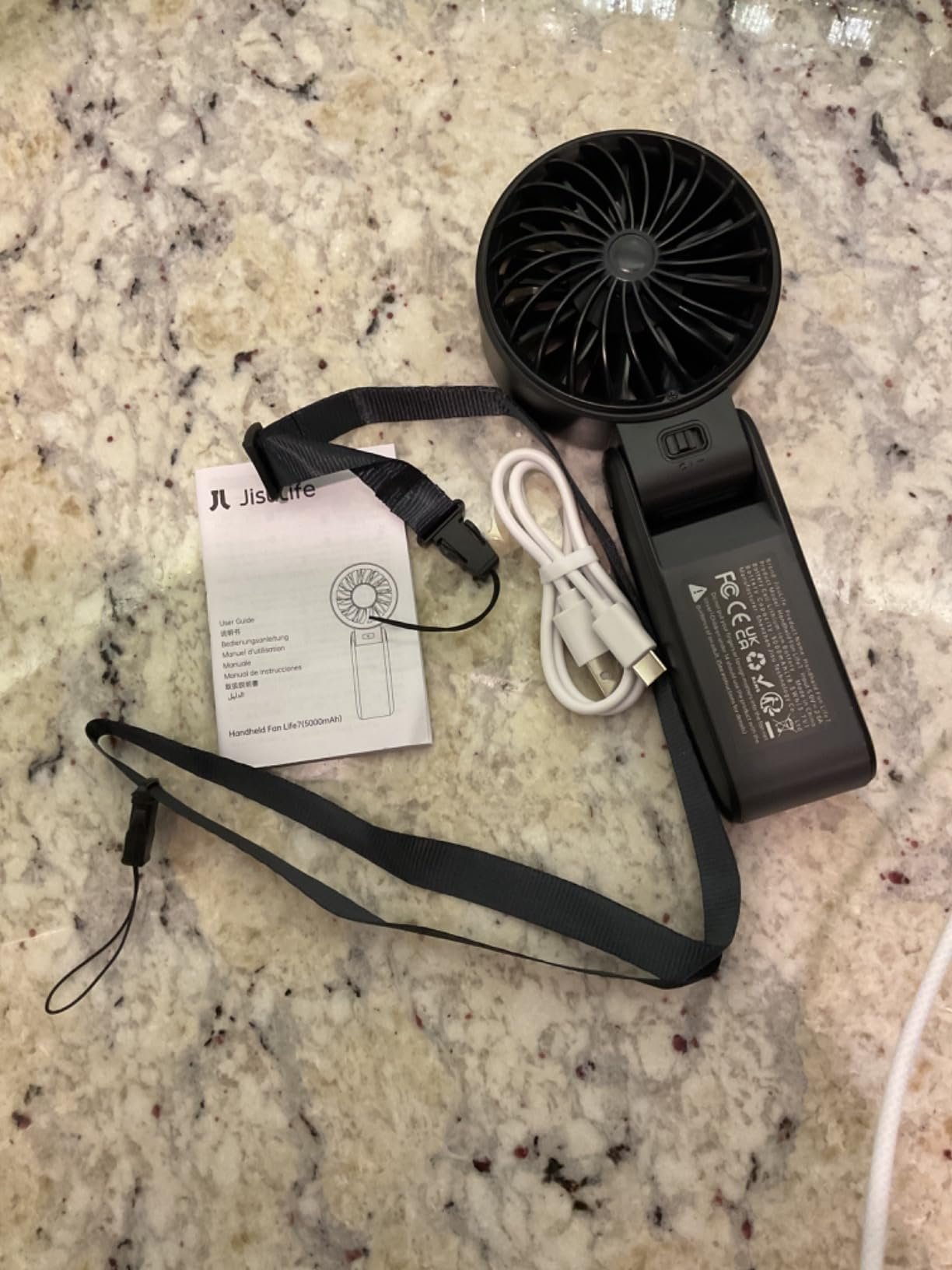 JISULIFE Handheld Fan Life7 – Ultimate Flexibility: High-Power Motor. LED Display. 19.5 Hrs Cooling. 5000mAh Rechargeable. 5-Speed. Foldable Design. 3-IN-1 Portable Fan for Travel Cruise Beach(Grey) photo review