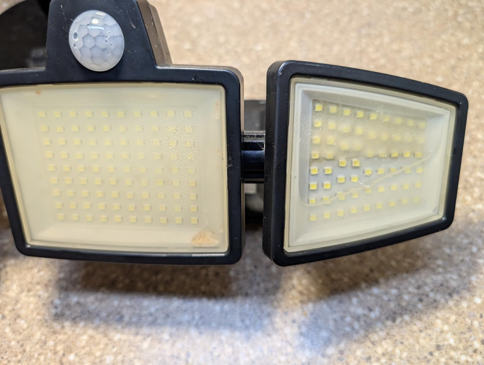 Tuffenough Solar Outdoor Lights 2500LM 210 LED Security Lights with Remote Control.3 Heads Motion Sensor Lights. IP65 Waterproof.270° Wide Angle Flood Wall Lights with 3 Modes(2 Packs) photo review